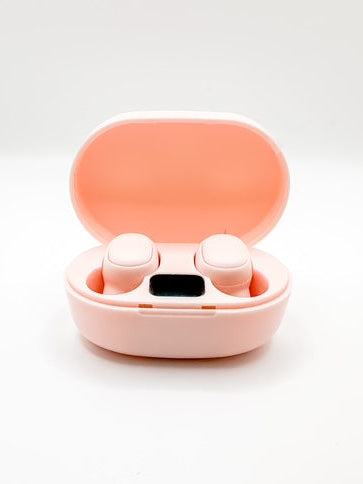 Pink wireless earbuds in a matching case on a white background