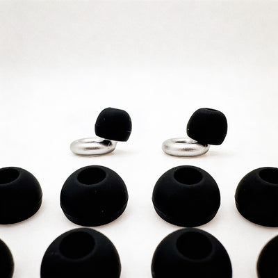 Black earbud tips with silver hooks on a white background