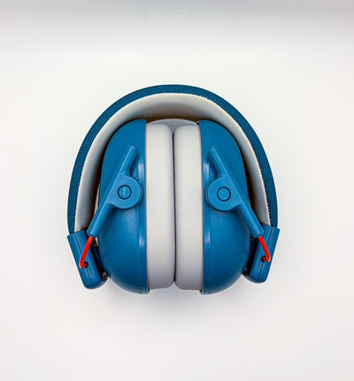 Blue and white headphones on a light gray background
