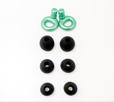 Green earbud tips and black rubber earbuds on a white background