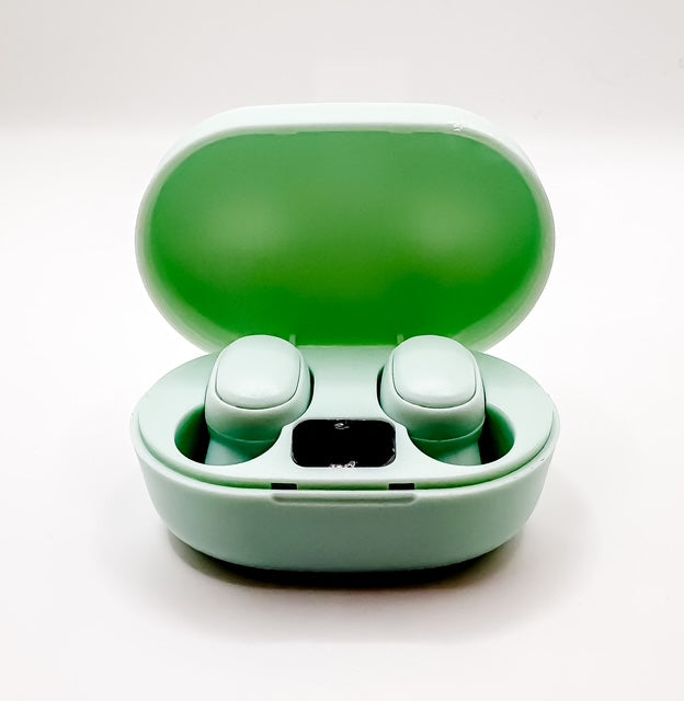 Green wireless earbuds in a matching case on a white background