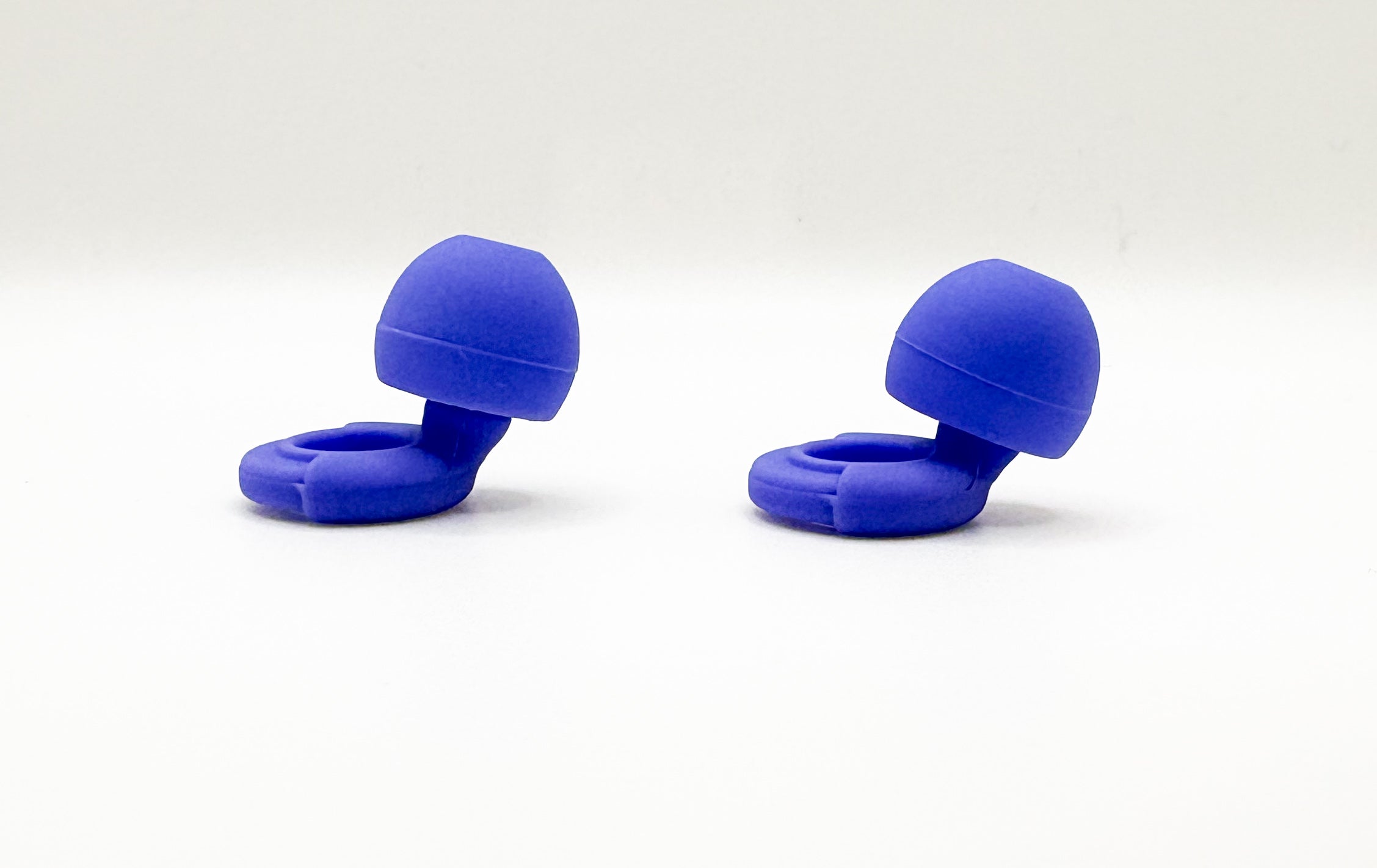 Pair of blue Ollybud tips on a white background