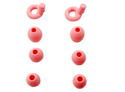Pink silicone ollybuds arranged on a white background