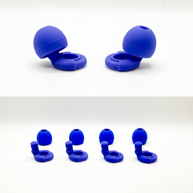 Set of blue silicone earbud tips on a white background