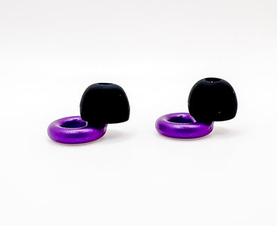 Two black and purple ollybuds on a white background