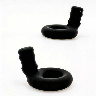 Two black rubber ollybuds on a white background