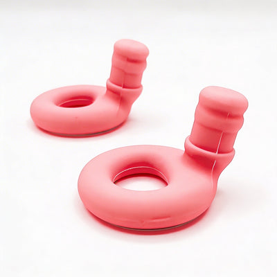 Two pink silicone earbuds products on a white background