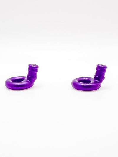 Two purple earbuds on a white background