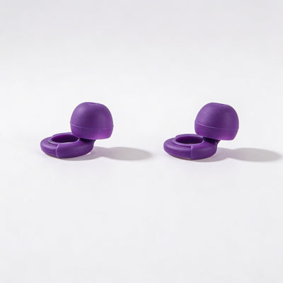 Two purple silicone earbuds on a white background