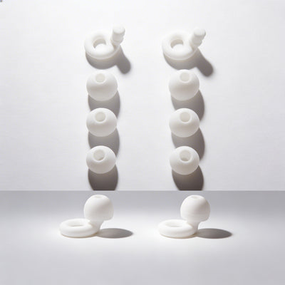 White Earbuds on a darkened background